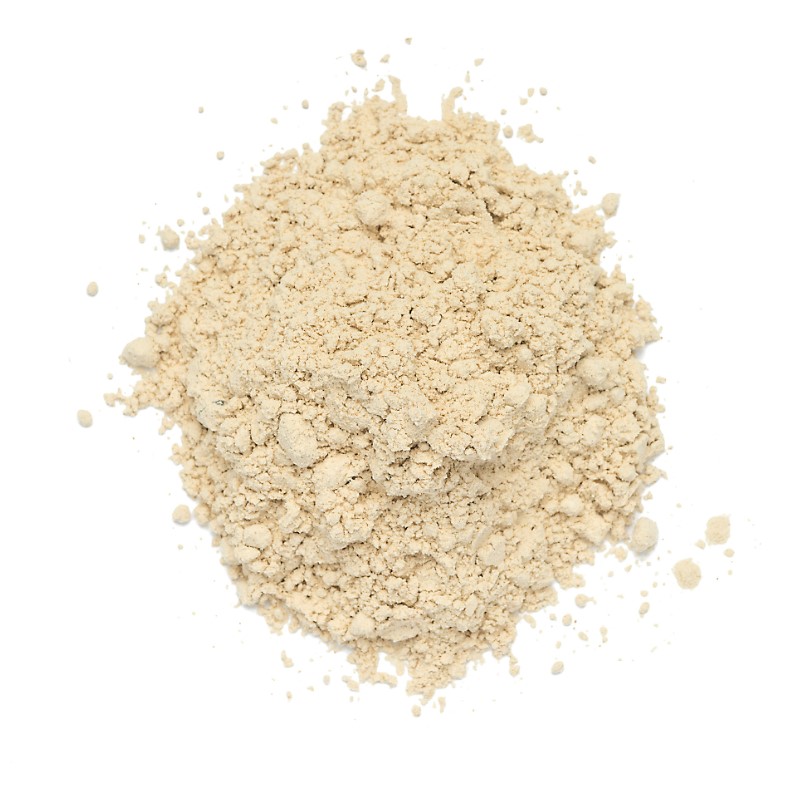 round dome of loose garlic powder on a white background