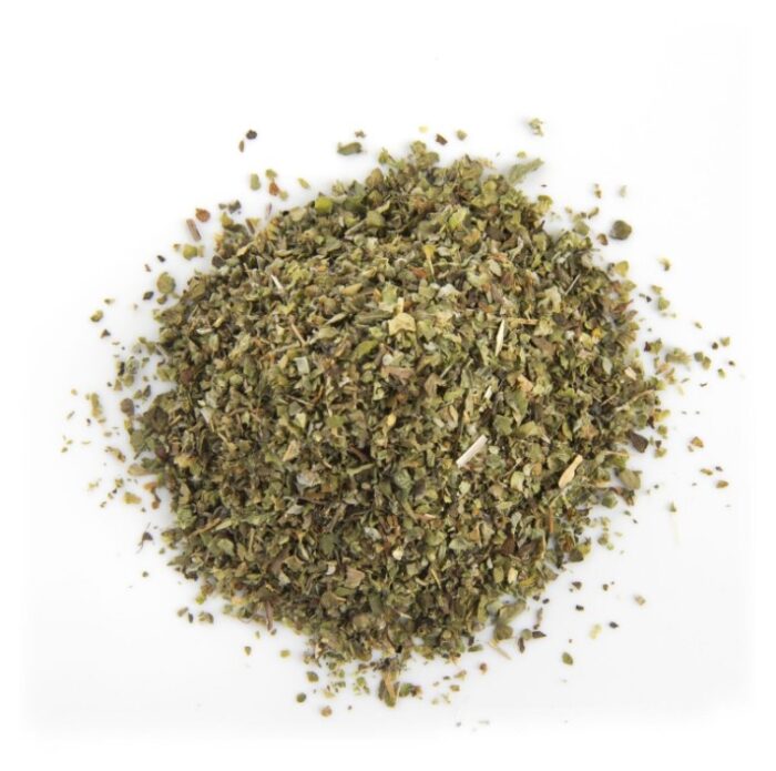 a loose pile of dried flaky herbs are arranged in a slightly domed circular shape with a white background