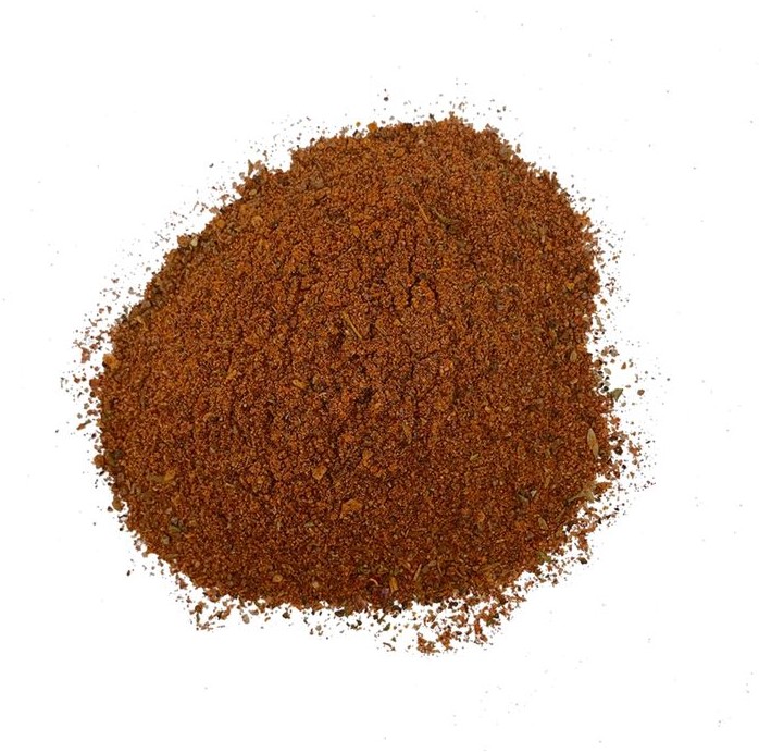 vaguely round mound on warm brown spice mix on a white background