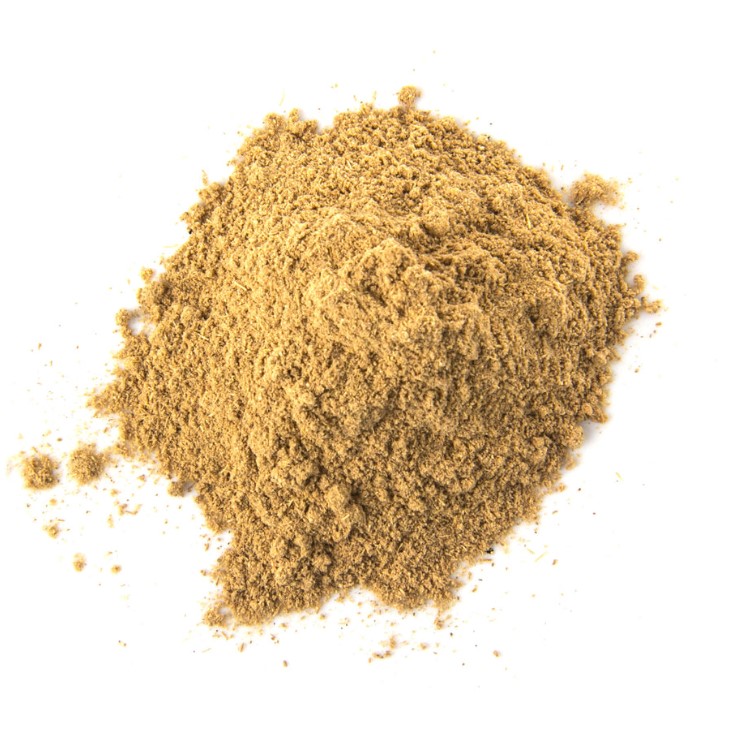 A round pile of muted yellow orange Galangal powder with a white background